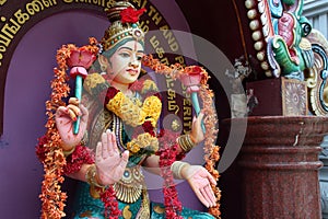 sculpted divinity in an hindu temple (sri senpaga vinayagar) - singapore photo