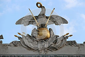 sculpted eagle and coat of arms on the roof of a gloriette in the gardens of the schönbrunn castle in vienna (austria)