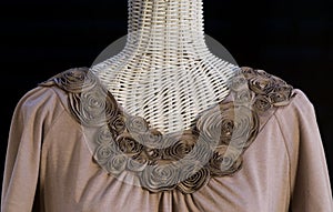 Sculpted flower neckline on new knit blouse