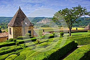 Sculpted gardens overlooking countryside of Dordogne, France photo