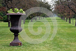 Sculpted plant urn in park photo