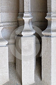 Sculpted ribbed block spindles in stone