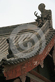 sculpted ridgepole in a buddhist monastery (shuanglin) closed to pingyao (china)