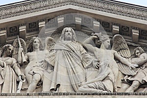 The sculpted tympanum of the `La Madeleine`church, Paris