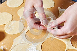 Sculpting of traditional Russian meat dumplings
