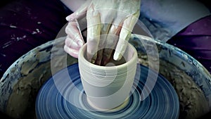 The sculptor in the workshop makes a jug out of earthenware closeup.