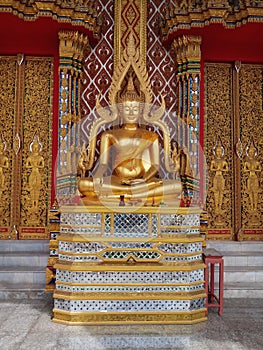 A sculptur of lord bouddha in a temple photo