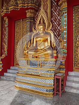 A sculptur of lord bouddha in a temple photo