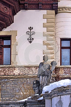 Sculptural composition of the 19th century and part of the architecture of Sinai, Romania. In the winter.