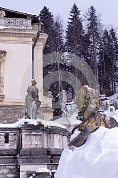 Sculptural composition of the 19th century and part of the architecture of Sinai, Romania. In the winter.