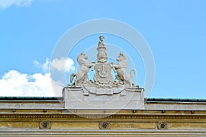 Sculptural composition of the coat of arms of noblemen Urusky on the building of the palace. Warsaw, Poland