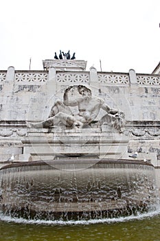 Sculptural detail of Tyrrhenian Fountain at Victor Emmanuel II monument in Piazza Venezia