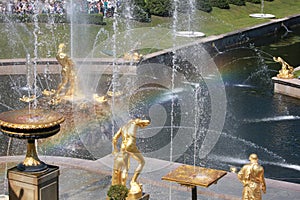 The sculptural ensemble of the Grand Cascade and rainbow on a sunny day. Peterhof