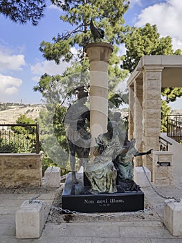 Sculptural group with the apostle Peter in the center in courtyard of the Church of St. Peter in Gallicantu