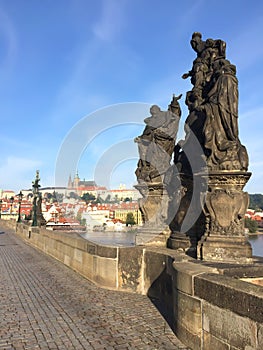 The sculptural group â€œMadonna, St. Dominic and St Thomas Aquinasâ€ on the Charles Bridge, Prague, Czech Republic