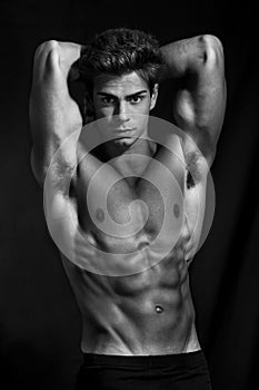 Sculptural man model perfect muscular body black and white