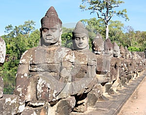 Sculptural stone group of guard soldiers at the gates of the ancient Angkor Wat is a temple complex in Cambodia