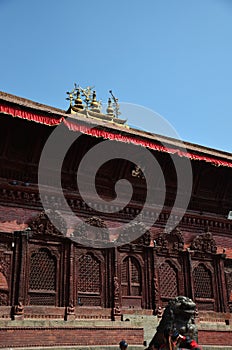 Sculpture ancient bronze napali lion singha guardian statues and carving wooden building Shiva Parvati hindu temple for people