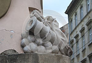 Sculpture of ancient cannon with kernels on the facade