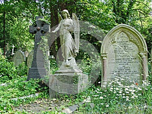 Sculpture of an angel on a grave, Highgate Cemetery, London, UK.