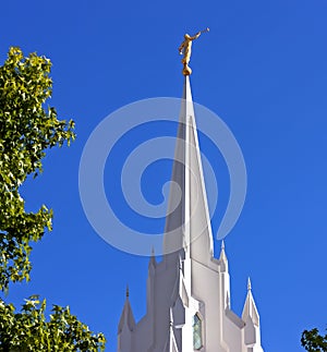 Sculpture of angel moroni atop of a Mormon Temple photo