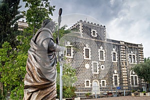 The sculpture of the Apostle Peter and Franciscan Monastery in C photo