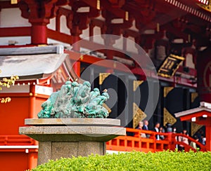 Sculpture on the background of the temple of Asakusa Schrein Senso-ji, Tokyo, Japan. With selective focus.