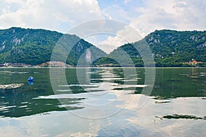 Sculpture bas-relief of the Dacian king Decebal, located on the rocky bank of the Danube in Romania. View from the coast of Serbia