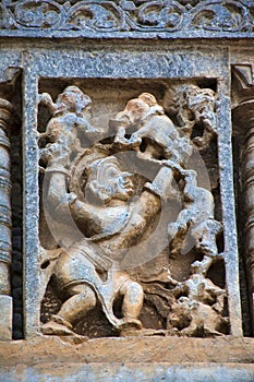 Sculpture of Bhima tossing the elephants like a toy. Chennakeshava temple. Belur, Karnataka. An episode from Mahabharata.