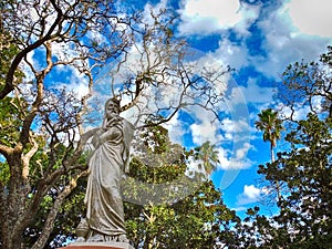 Sculpture with a blue sky and trees