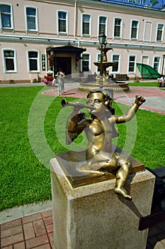 Sculpture of boy with pipe