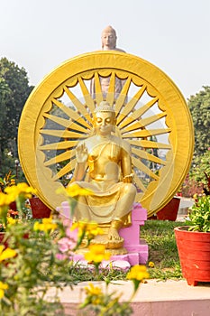 Sculpture of Buddha next to Wat Thai Sarnath Temple in Sarnath