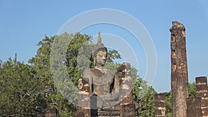 Sculpture Buddha on the ruins of an ancient Buddhist temple. Sukhothai, Thailand