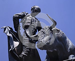 Sculpture of a bullfighter executing a task
