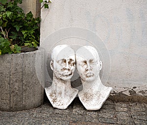 Sculpture, bust, head in the street, street art, space for text, wall texture, a man, woman plaster bust, abstract fancy