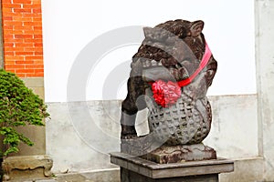 Sculpture of a Chinese lion made of stone.