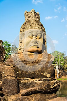 The sculpture of the demon at the entrance to Angkor thom castle.