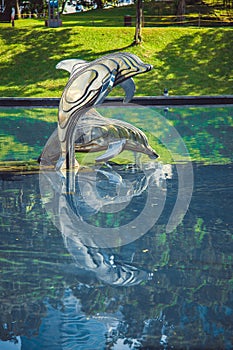 Sculpture of dolphins in the city park. Kuala Lumpur, Malaysia.