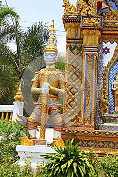 Sculpture of door guard known as Vesavanna, the guardian of north guarding the entrance of the temple at Ban Bung Sam Phan Nok, Ph photo