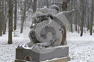 The sculpture of the dragon on the bridge closeup gloomy winter day. Tsarskoye Selo