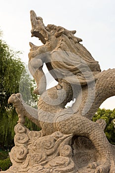 Sculpture of dragon carved in stone in Longtan Park in Beijing, China