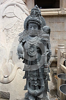 Sculpture of dvarapala at the feet of Gommateshwara/Bahubali statue at Shravanabelagola photo