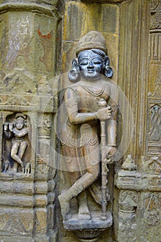 Sculpture of dwarpala on the wall of Trishund Mayureshshwar Ganesh Temple photo