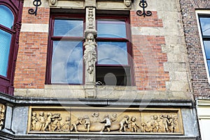 Sculpture in a facade in Amsterdam, Netherlands