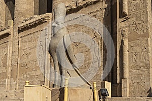 Sculpture of a falcon in a crown at the entrance to the Temple of Horus in Edfu.