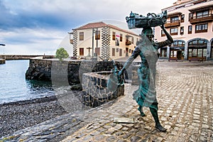 A sculpture of a fishwife in the fishing port in Puerto de la Cruz, Spain. photo