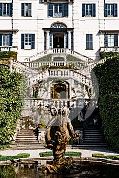 Sculpture by the fountain in front of the steps to Villa Carlotta. Lake Como, Italy