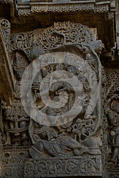 Sculpture and frieze on the outer walls of Hoysaleswara Temple at Halebidu , Karnataka, India