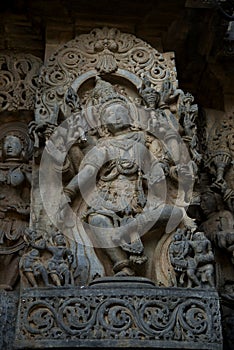 Sculpture and frieze on the outer walls of Hoysaleswara Temple at Halebidu , Karnataka, India