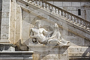 Sculpture in front of stairs of Palazzo Senatorio at Piazza del Campidoglio, Rome, Italy